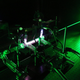 A bright green laser shoots through an experimental set-up in France.